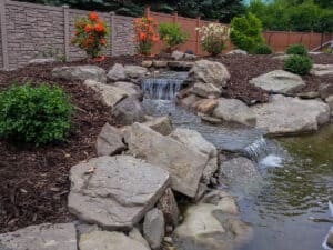 Small Water Feature Waterfall with Shrubbery and Mulching